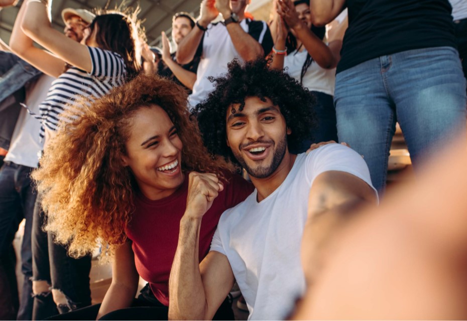 Two people celebrating at an atheltic game