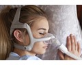 Woman sleeping in a CPAP mask