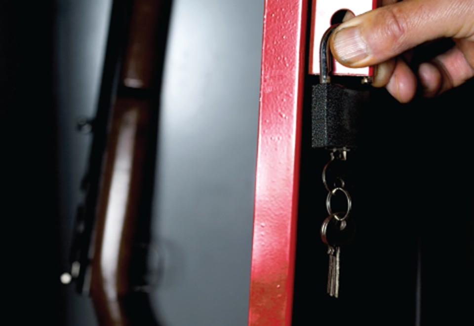 Person locking up a firearm