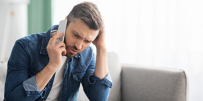 Concerned man on a cell phone