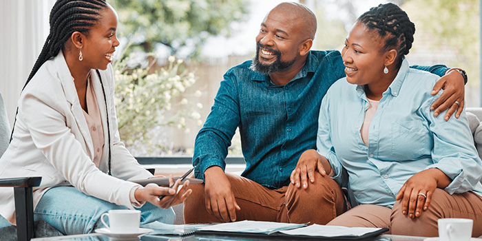 Woman financial counselor meting with couple