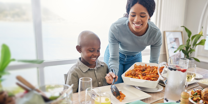 Mother serving her son a healthy dinner