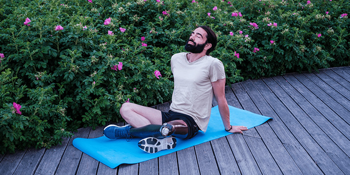 Man on yoga mat meditating