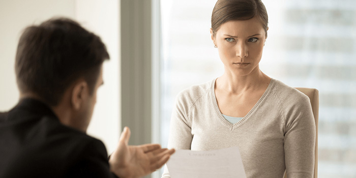 Woman listening to a man with skepticism