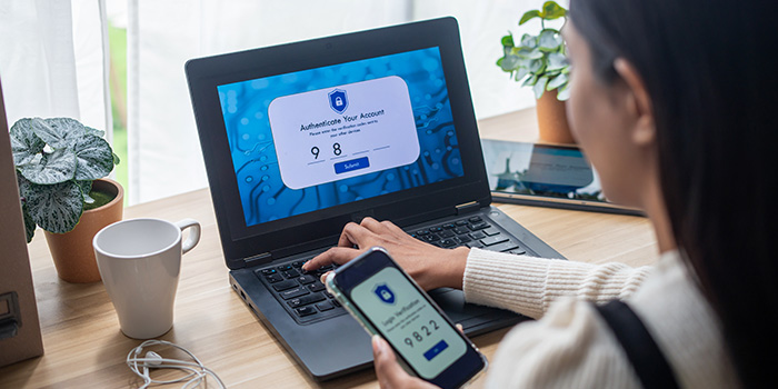 Woman using two-factor authentication to securely access online banking