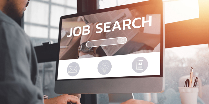 Man using a computer to look for a job