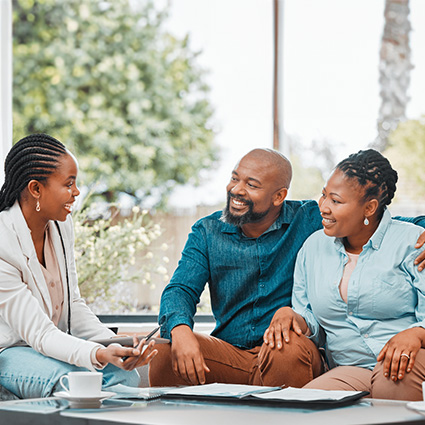 Woman financial counselor meting with couple