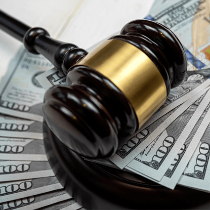 Gavel and hundred dollar bills