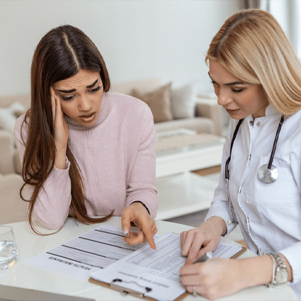 Women reviewing medical bills