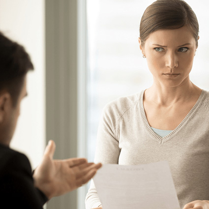 Woman listening to a man with skepticism