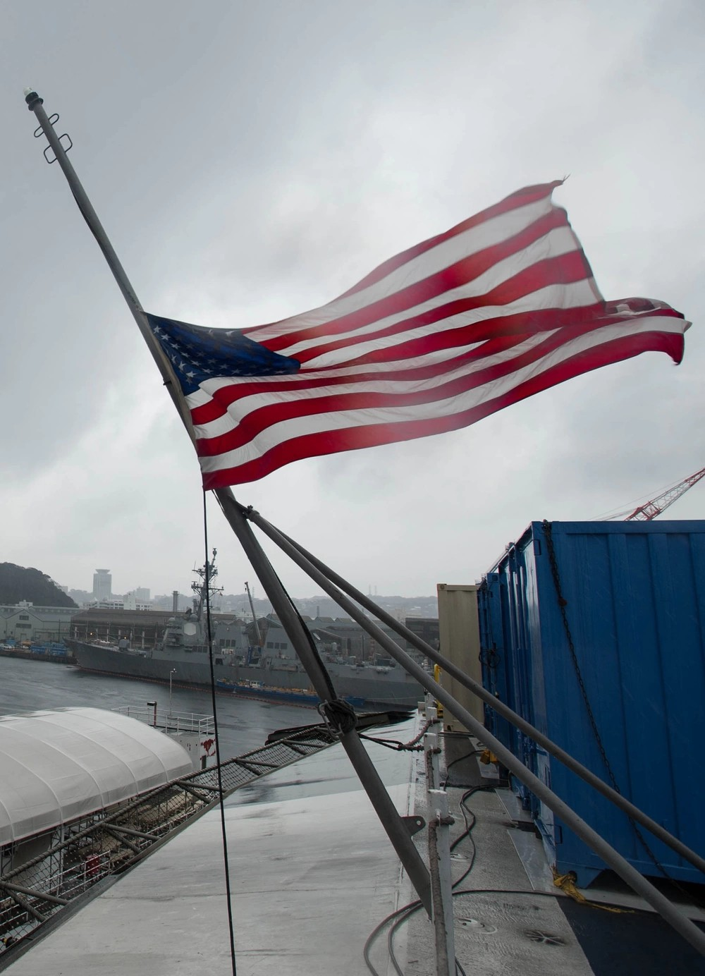 160307-N-OI810-232 YOKOSUKA, Japan (March 7, 2016) The ensign is flown at half-mast aboard the U.S. Navy's only forward-deployed aircraft carrier USS Ronald Reagan (CVN 76) in remembrance of former first lady Nancy Reagan. Reagan served as the ship's sponsor since its commissioning in 2003. (U.S. Navy photo by Mass Communication Specialist 3rd Class Nathan Burke/Released)